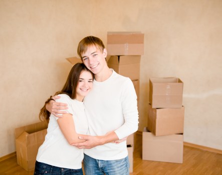 Removal team safely lifting furniture during a planned move