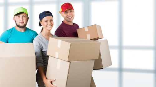 Professional movers handling furniture in Battersea