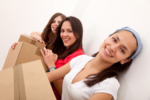 Specialist movers transporting office furniture in Battersea