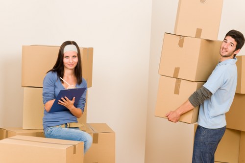 A professional moving team handling Battersea relocations with care in an apartment building