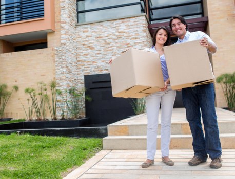 Professional movers handling packed boxes during a Battersea relocation